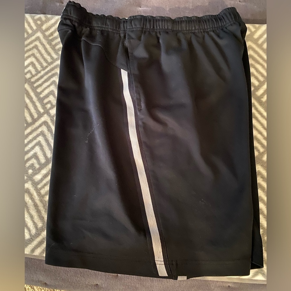 Nike Black Athletic Shorts polyester white strip on sides, side pockets
C
